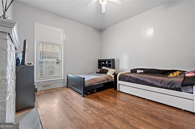 bedroom with hardwood / wood-style flooring and ceiling fan