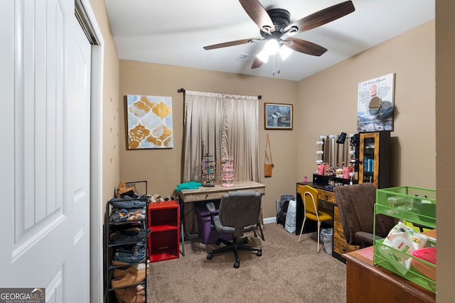 home office with carpet floors and ceiling fan