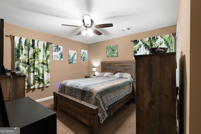 bedroom featuring carpet, visible vents, baseboards, and a ceiling fan