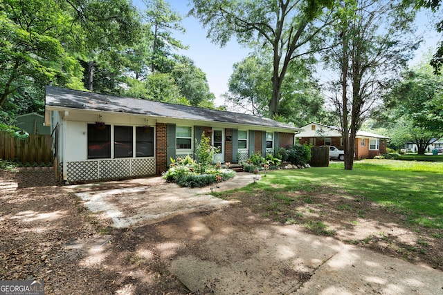 ranch-style house with a front lawn