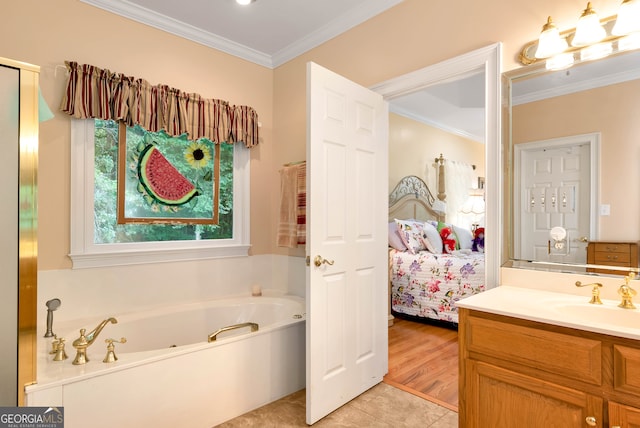 bathroom with hardwood / wood-style floors, vanity, a bathing tub, and ornamental molding