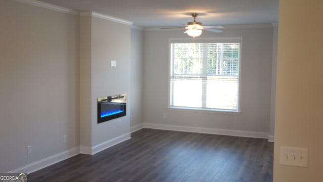 empty room featuring crown molding, ceiling fan, and dark hardwood / wood-style flooring