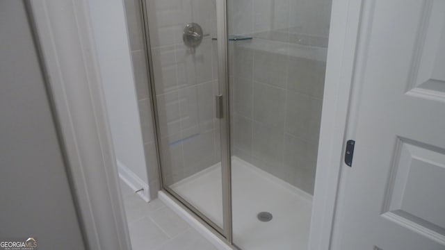 bathroom featuring an enclosed shower