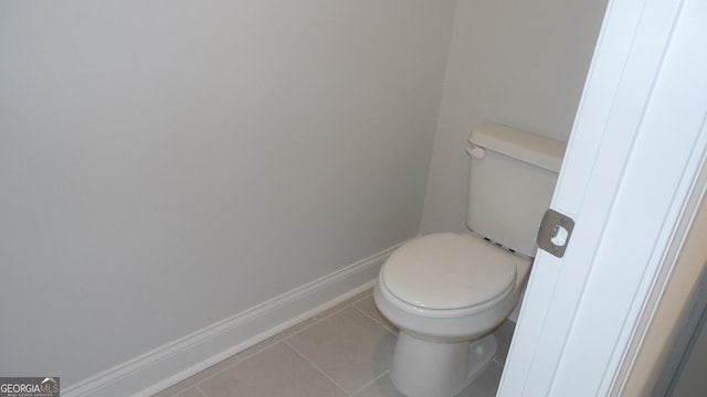 bathroom with tile patterned floors and toilet