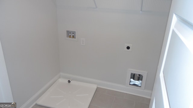 laundry area featuring hookup for a washing machine, electric dryer hookup, and tile patterned floors