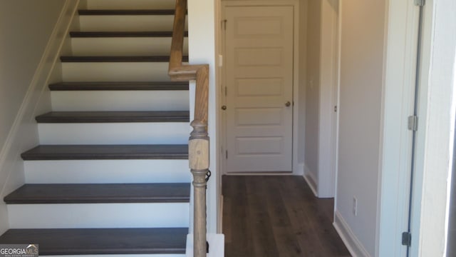 stairway with hardwood / wood-style flooring