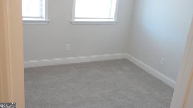 empty room featuring carpet floors