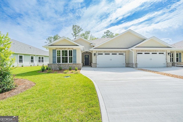 view of front of property with a front yard and a garage