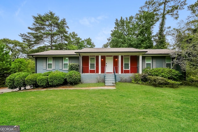 ranch-style house with a front lawn, a porch, and brick siding