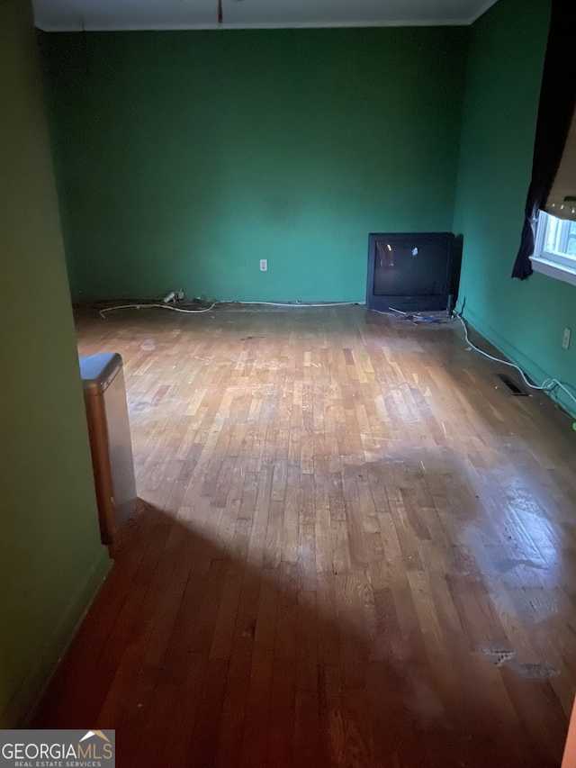 spare room with hardwood / wood-style flooring