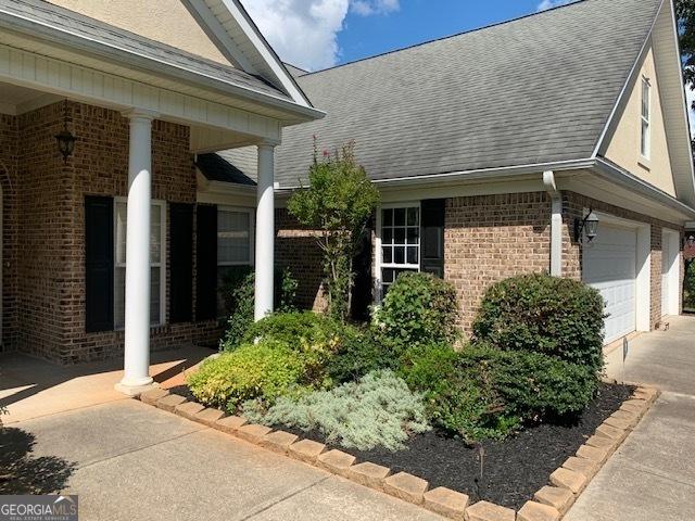 view of property exterior featuring a garage