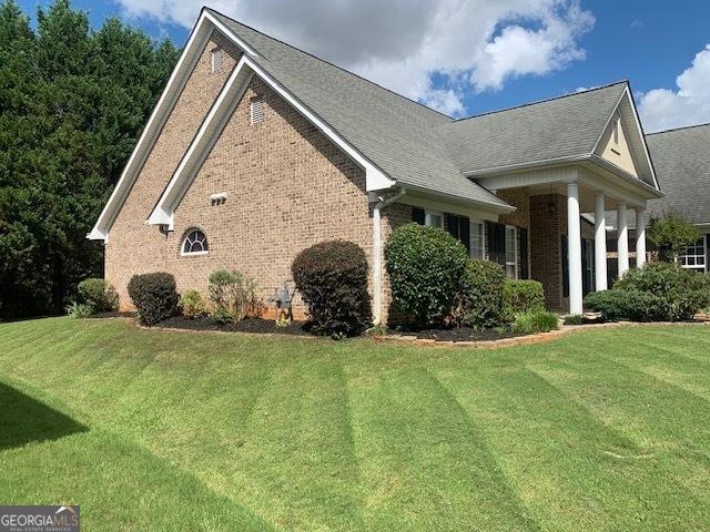 view of home's exterior featuring a lawn