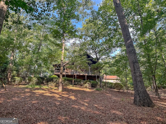 view of yard with a wooden deck