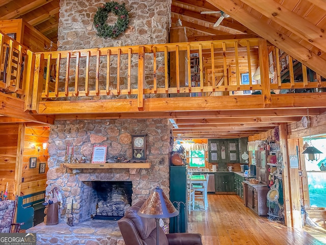 unfurnished living room featuring a fireplace, wooden ceiling, hardwood / wood-style flooring, and a wealth of natural light