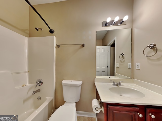 full bathroom featuring vanity, bathing tub / shower combination, and toilet