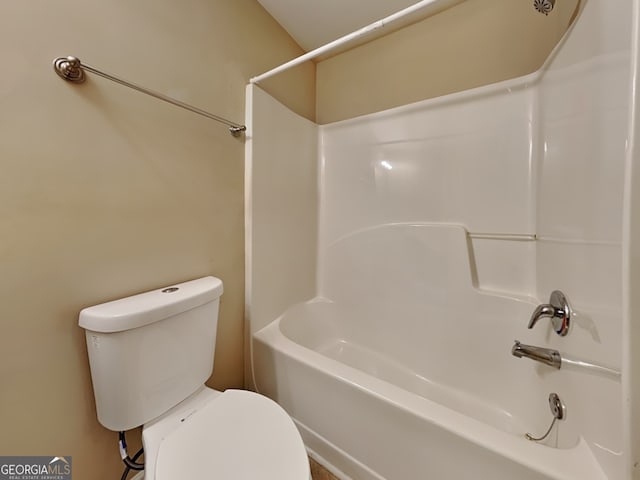 bathroom featuring  shower combination and toilet