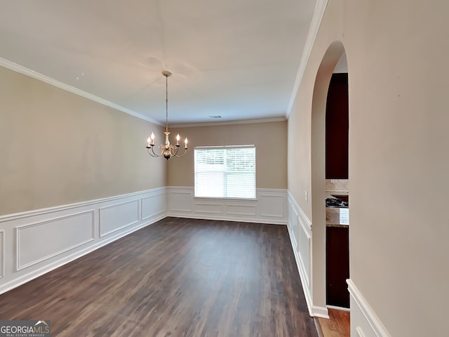 unfurnished dining area featuring an inviting chandelier, crown molding, and dark hardwood / wood-style floors