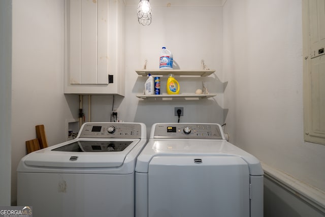 washroom with washing machine and clothes dryer