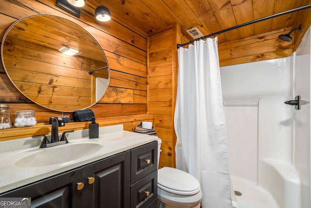 bathroom featuring wooden walls, toilet, wood ceiling, and vanity