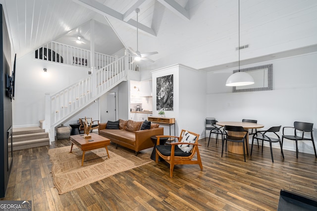 living room with beamed ceiling, hardwood / wood-style floors, ceiling fan, and high vaulted ceiling