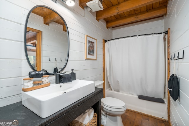 full bathroom with shower / bath combo, toilet, beam ceiling, wooden ceiling, and wood-type flooring