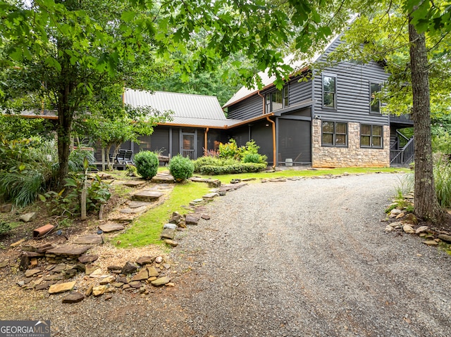 view of front of house featuring a sunroom