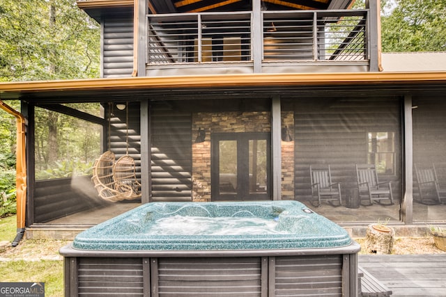 exterior space with a hot tub