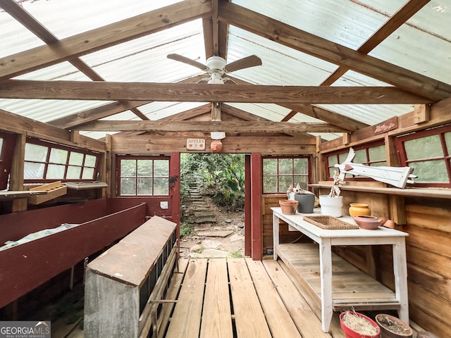 interior space with ceiling fan