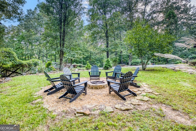 view of yard with a fire pit