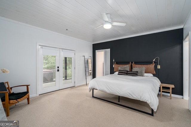 carpeted bedroom featuring ceiling fan, crown molding, french doors, access to exterior, and wood ceiling