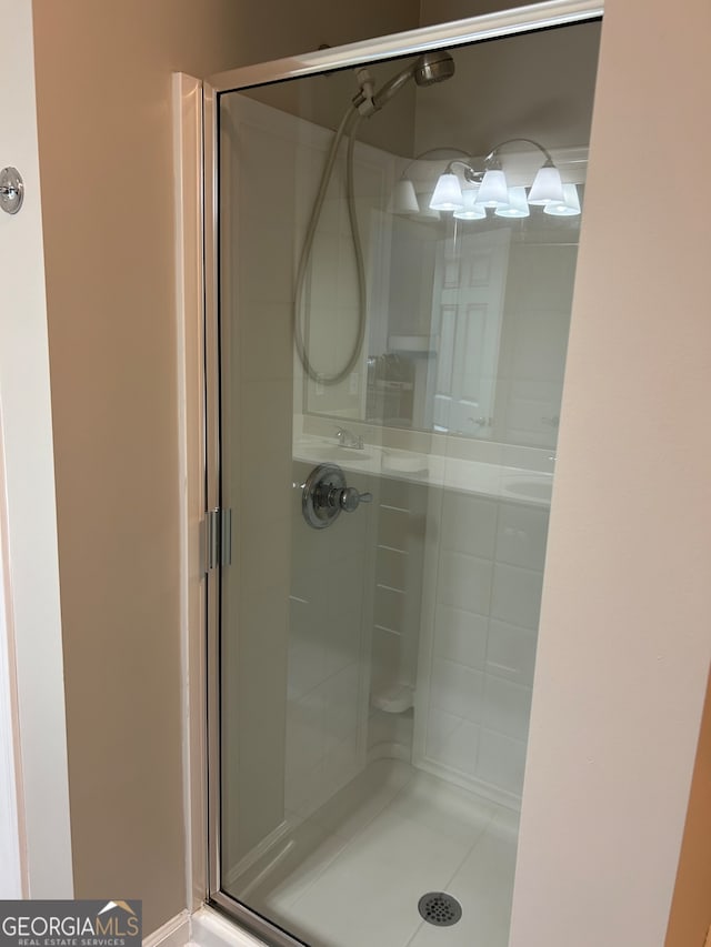 bathroom featuring an enclosed shower