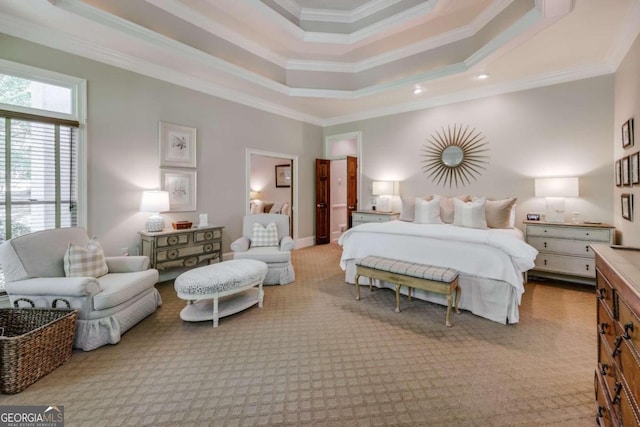 bedroom featuring a tray ceiling, carpet flooring, and crown molding