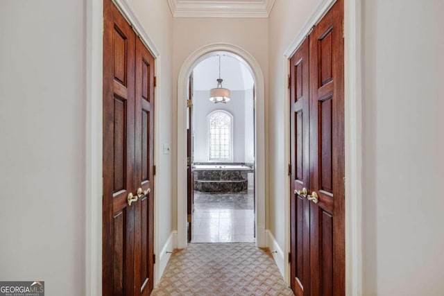 corridor featuring ornamental molding