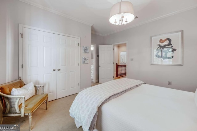 bedroom featuring crown molding, a closet, a chandelier, and light colored carpet