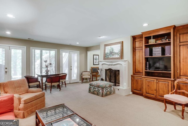 carpeted living room with french doors