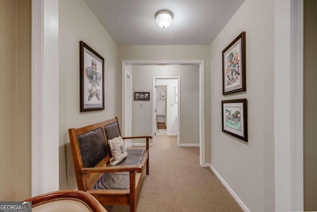 hallway with light colored carpet