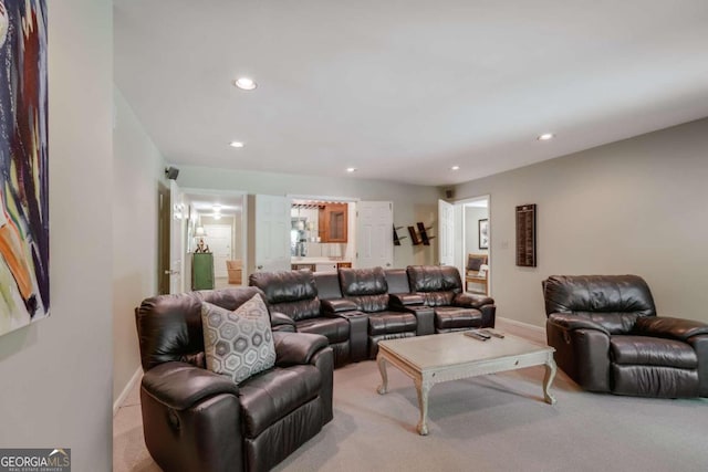 living area with light carpet, baseboards, and recessed lighting