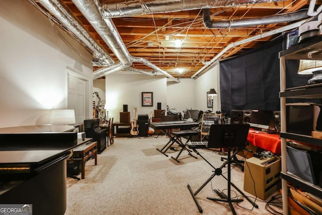 basement featuring light colored carpet