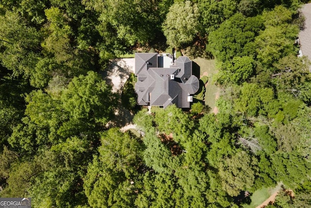 bird's eye view featuring a forest view