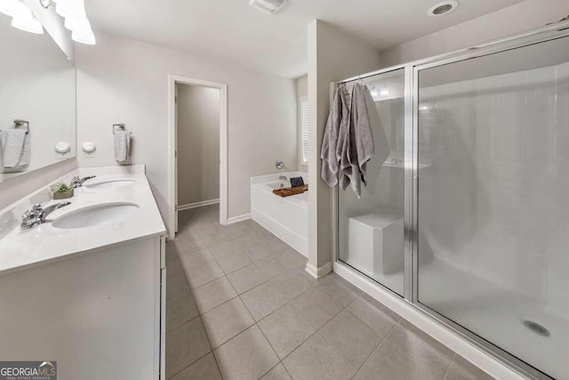 bathroom featuring tile patterned flooring, vanity, and independent shower and bath