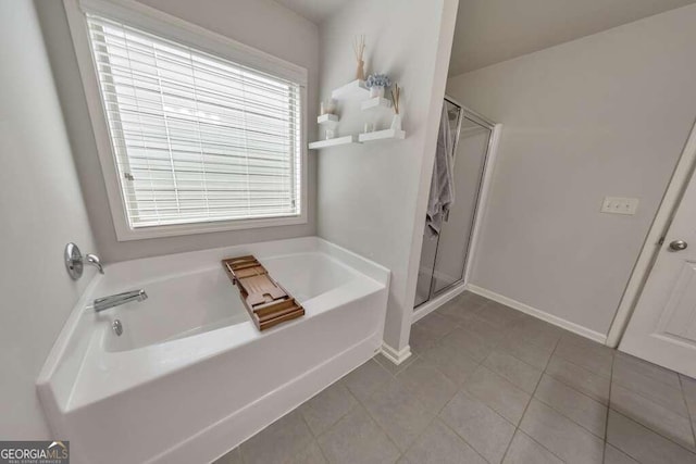 bathroom with tile patterned flooring and independent shower and bath