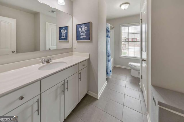 full bathroom featuring shower / bath combination with curtain, vanity, toilet, and tile patterned flooring