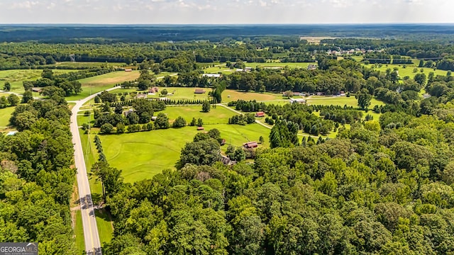 drone / aerial view featuring a forest view