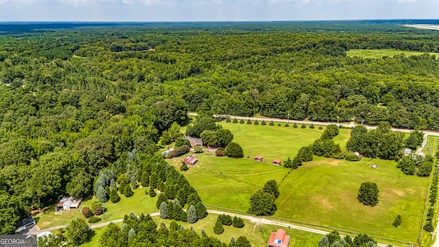 aerial view with a wooded view