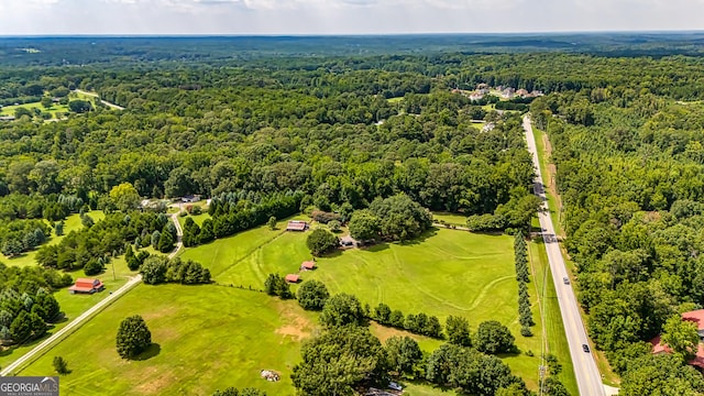 aerial view featuring a view of trees