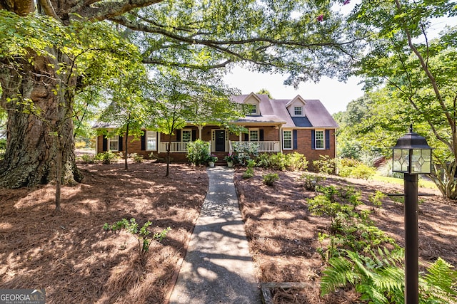 cape cod house with a porch