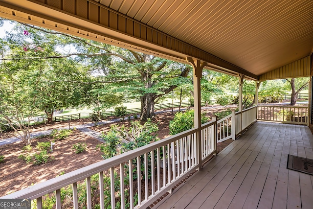 wooden terrace featuring a porch