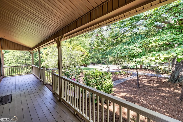 wooden terrace with a porch