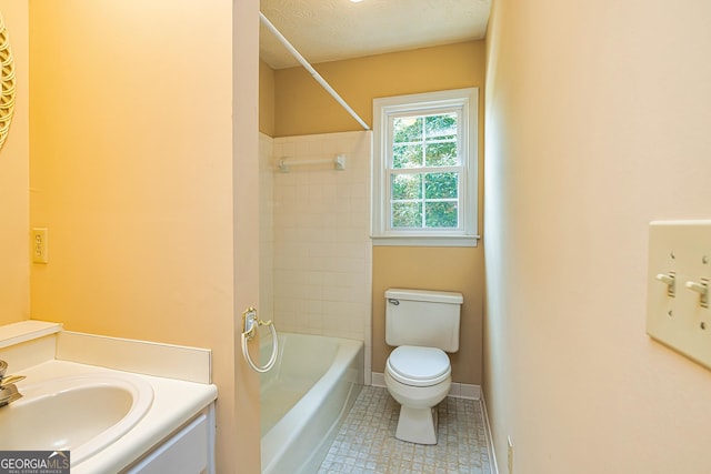 full bath with toilet, tub / shower combination, vanity, a textured ceiling, and baseboards