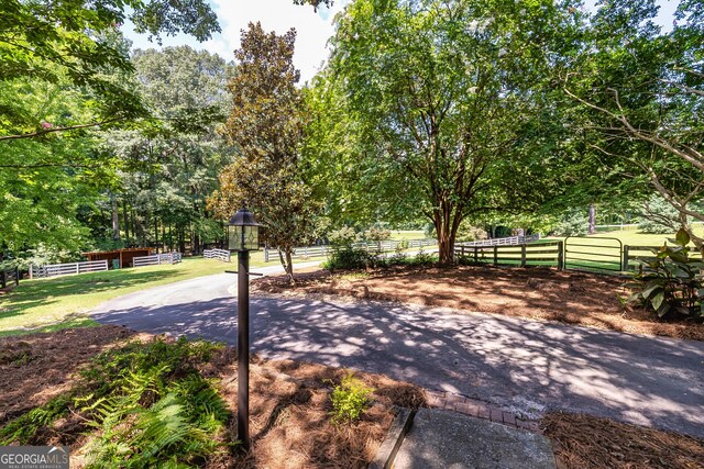 view of community featuring fence